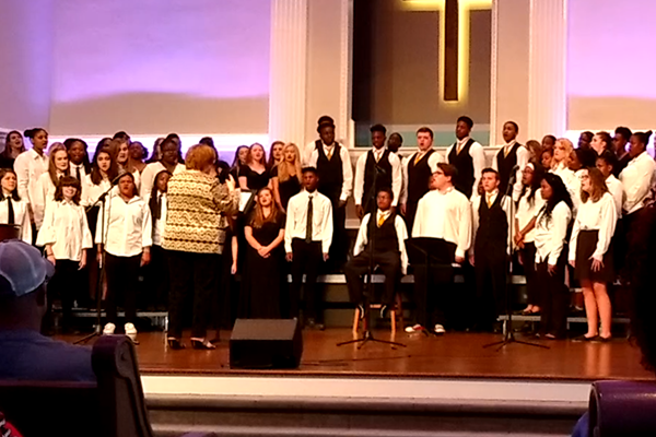 BOUTWELLS LAST CENTRAL CONCERT -- Mrs. Boutwell directs the Freshman and Concert choirs in their last concert with her.