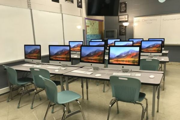 NEW IMACS IN THE COMPUTER LAB IN C-POD -- The new iMacs in the C-Pod computer lab are a great new tool for Mrs. Ware to use in her Computer Applications class.