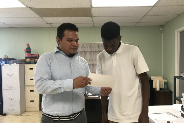 TEACHER SPOTLIGHT: CENTRAL SAYS BIENVENIDO TO NEW SPANISH TWO TEACHER, SALVADOR PINA -- New Spanish teacher, Salvador Pina, helps his student, Brian McKibben, with his Spanish work.