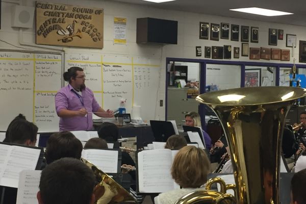 TREVOR WHITE JOINS CENTRAL FAMILY AS BAND STUDENT TEACHER -- Mr. White leads the band in a warm-up chorale before they start to work on the harder, more technical music.