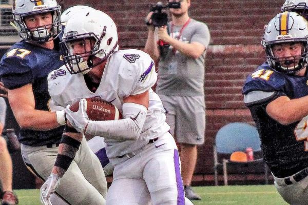 POUNDERS FOOTBALL TEAM HAS EARLY SUCCESS ON CREATING CENTRALS LEGACY -- Junior Hunter Jones runs the ball in hopes of a another Pounder touchdown!