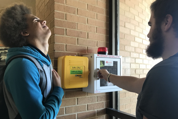 AEDS INSTALLED AS A RESULT OF NEW BILL BEING PASSED -- Students analyze new AED and Epi-pens established near the front entrance.