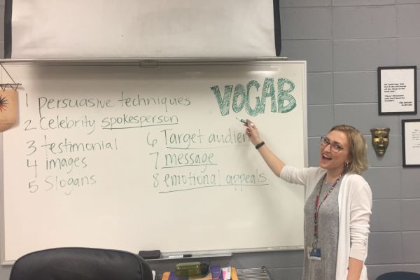 ENGLISH STUDENT TEACHER, SAMANTHA LANGE, PURSUES A CAREER IN TEACHING -- Samantha Lange helps Kevin Parsons, teach the freshmen English class.