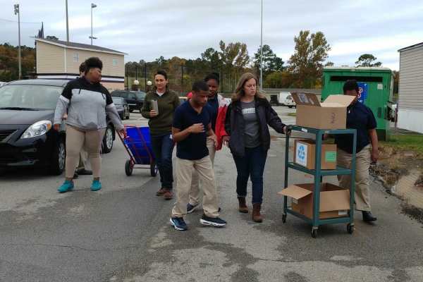 CENTRAL STUDENTS KEEP THE CAMPUS CLEAN BY RECYCLING -- Mrs. VanderWilt's class taking recyclable items to go recycle them. 