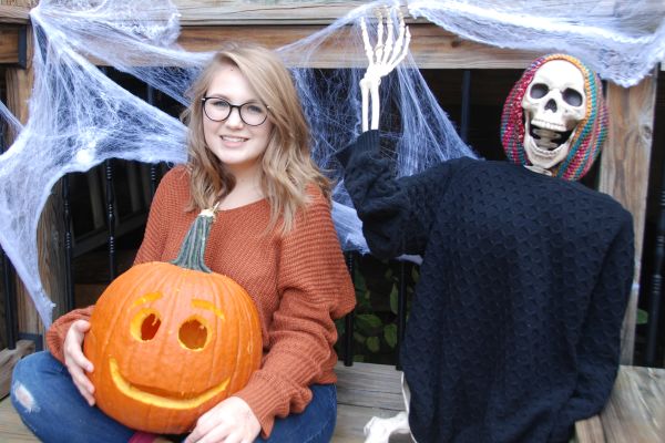 TWO TRUTHS, ONE LAURELIE: SPOOKY SEASON-- Columnist poses with her completed pumpkin.