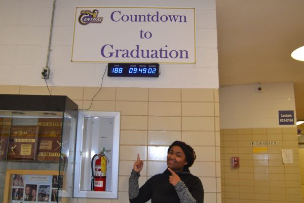 ADMINISTRATION ANNOUNCES NEW GRADUATION DATE -- Senior enthusiastically points out the countdown to graduation.