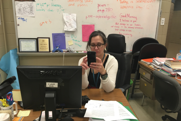 CENTRALS SOCIAL MEDIA STRUGGLE -- English teacher, Ms. Sally White, looking over her phone in deep thought about social media.