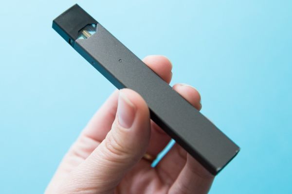 EDITORIAL: IS VAPING AN ISSUE IN HAMILTON COUNTY SCHOOLS? ---
A vaper holding up a popular brand of vape called a Juul.