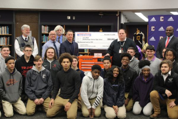 CENTRAL'S SKILLED TRADES CLASSES RECEIVES $50,000 PRIZE -- Jerry Webb and his students were presented with the check along with school officials and a Harbor Freight representative.