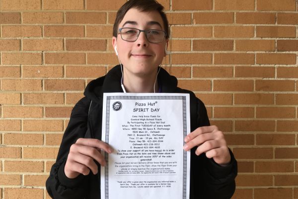 CENTRALS TRACK TEAM PARTNERS WITH PIZZA HUT TO CREATE FUNDRAISER-- 
Freshman Jaiden Hutton holds up one of the many fliers that are hung around Central HIgh School for the Track Team’s partnered fundraiser.