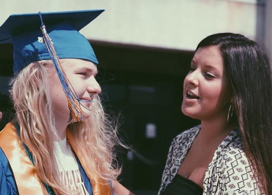 CENTRAL ALUMNUS MORGAN LYNCH NOW SODDY DAISY EXCEPTIONAL EDUCATION TEACHER --- (Left to right) Hannah Walker (18) was supported by Morgan Lynch (12) at Centrals 2018 graduation.