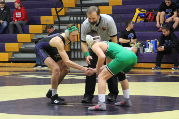 CENTRAL’S WRESTLING TEAM HOPES TO SEND MULTIPLE PLAYERS TO REGION TOURNAMENT -- Jack Neely shakes his opponent's hand before starting the match.