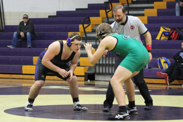 CENTRAL’S 2018-19 WRESTLING TEAM ANTICIPATES SUCCESSFUL SEASON — Junior Donavyn Walker faces off the opposing team member after doing a cordial introductory handshake.