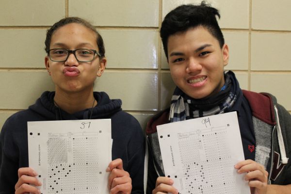 SHOULD STUDENTS BE SEGREGATED IN SCHOOL BASED ON ABILITY? -- Alexis Massengale (left) and Matthew Phan (right) show off their contrasting grades. 