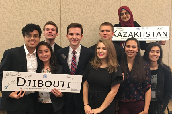 STUDENTS REPRESENT CENTRAL AT ANNUAL MODEL UNITED NATIONS CONFERENCE -- Central students representing either Djibouti or Kazakhstan at 2018's Model UN. From left to right: Hanton Guerrero, Cassandra Castillo, Jake Johns, Preston Fore, Laurelie Holmberg, Matthew Frazier, Zeena Whayeb, Deanna Wnuk, and Danae Wnuk. File Photo from 2018.