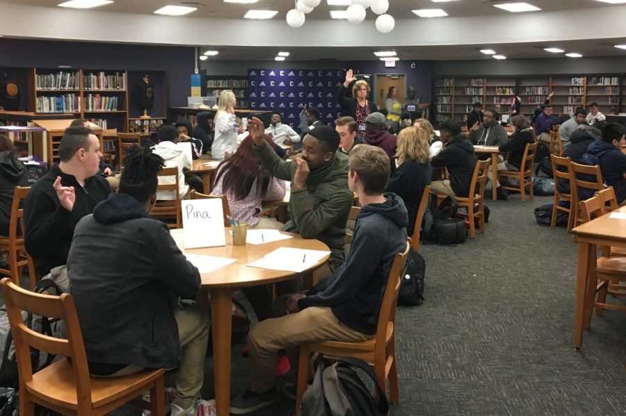 JUNIORS PREPARE FOR IMPORTANT ACT TESTING DURING ADVISORY -- Students raise their hands to answer a few ACT practice problems as teachers explain what the question is asking.