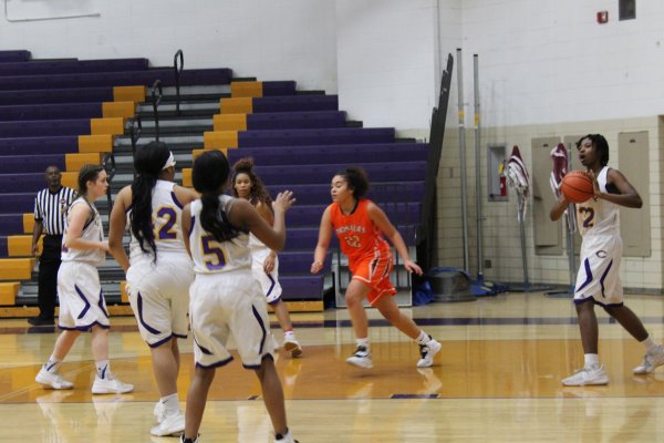 LADY POUNDERS BASKETBALL TEAM LOOKS BACK ON THIS SEASON’S ACHIEVEMENTS -- Central’s girls basketball teammates work together to score a basket.