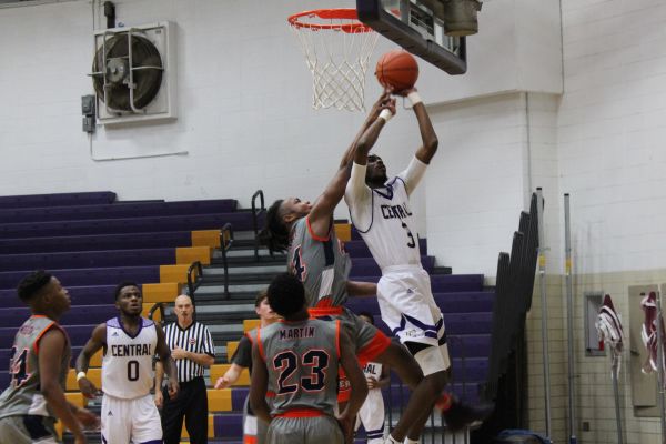 CENTRALS BOYS BASKETBALL TEAM AIMS TOWARD SUCCESS THIS SEASON -- Centrals Boys Basketball team takes on the East Ridge Pioneers in a heated match. 