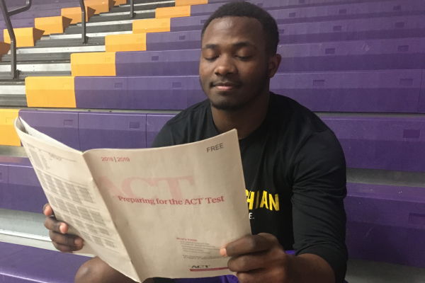 HAMILTON COUNTY PROVIDES SENIORS WITH FREE ACT PREPARATION COURSE -- Senior Michael McGhee is looking through his ACT practice booklet to review for his exam.