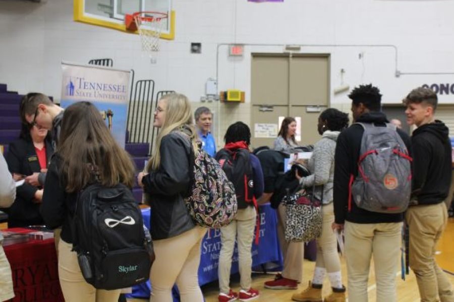 2019 CENTRAL HIGH SCHOOL COLLEGE FAIR-- Students crowd around booths to view their desired colleges.