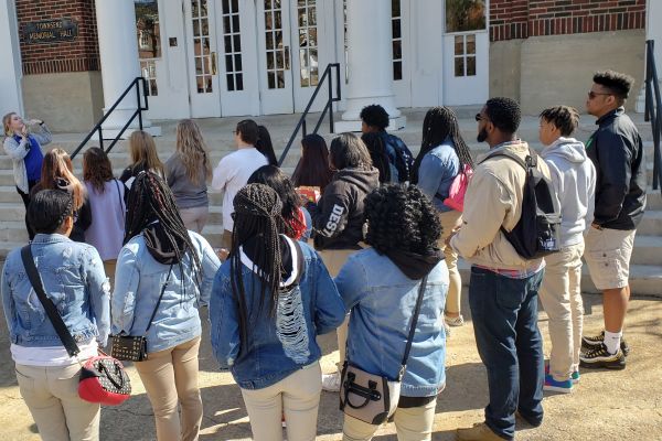 ONPOINT CLUB EMBARKS ON COLLEGE TOUR -- The OnPoint club listens to a presentation outside of Wesleyan Universitys library.