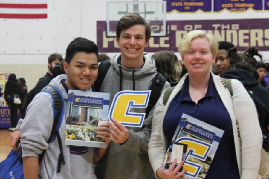 2019 CENTRAL HIGH SCHOOL COLLEGE FAIR-- Three seniors pose with UTC brochures.