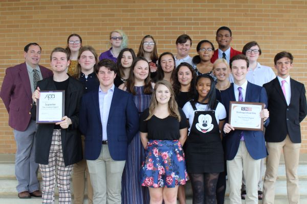 THE CENTRAL DIGEST NAMED A SNO NATIONAL WEBSITE OF DISTINCTION FOR THE THIRD YEAR IN A ROW -- The 2018-2019 Central Digest staff is pictured above with the plaque commemorating their title of SNO National Website of Distinction.”