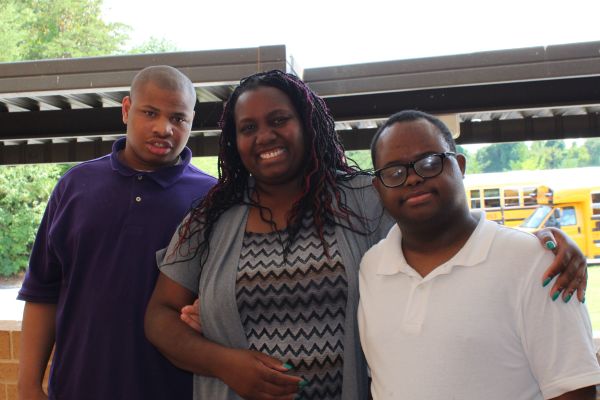 COURTNEY PARHAM JOINS THE CENTRAL FAMILY AS NEW COMPREHENSIVE PROGRAM TEACHER - - Ms Courtney Parham pictured with two of her students, Dominique Armour (left) and Pierre Joseph (right).