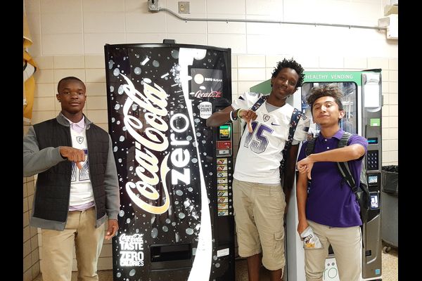 THE VENDING MACHINES ARE NOT ALL THAT AND A BAG OF CHIPS -- Three students show their disapproval of the lunchroom vending machines.