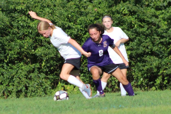 Central's Girls Soccer Team Reaches its End - - Ladies Soccer Captain, Cassandra Castillo, chases her opponent for the ball.