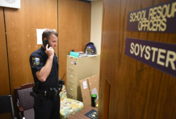 CENTRAL HIGH SCHOOL AND BROWN MIDDLE LACK FULL TIME SRO -- Officer Soyster takes a call in his office at  Central High School.