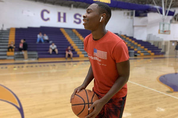 AN INSIDE LOOK AT THE UPCOMING 2019-2020 BOYS BASKETBALL SEASON -- Senior Tavarus Grayson goes to shoot a basket before his practice. 