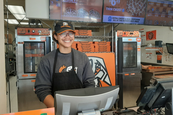 STOP KILLING TIME, MAKE IT WORK FOR YOU INSTEAD -- Central Senior Jazmynn Ball is smiling behind the registers at Little Caesars, where she works part-time.