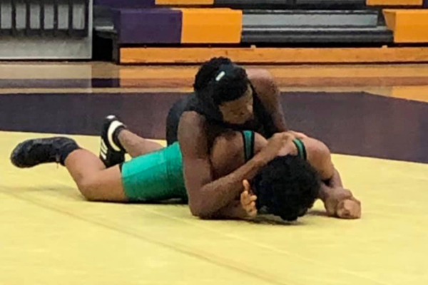 CENTRAL’S WRESTLING TEAM TAKES ON EAST HAMILTON -- Centrals wrestling team fights hard during a recent match.