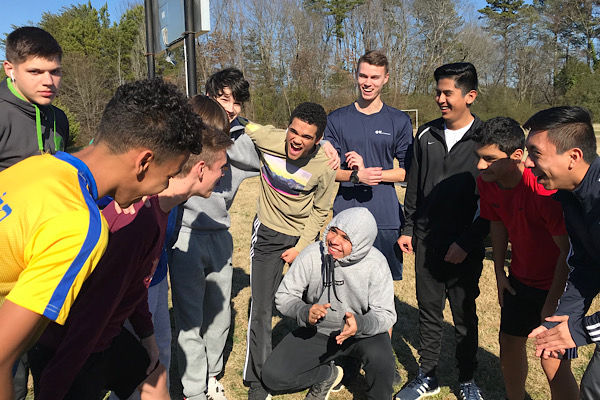 BOYS SOCCER AIMS FOR A SEASON FULL OF VICTORY -- The team gathers as Captain Patrick Quinn talks to them before practice.