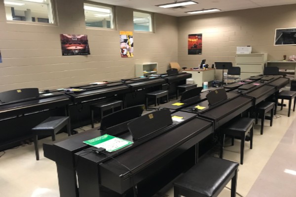 LATHAM INTRODUCES A POSSIBLE PIANO CLASS TO CENTRAL HIGH -- The Piano Lab located at East Hamilton High School.