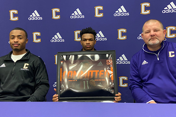 SENIOR MARQUIS RAY SIGNS TO MARYVILLE COLLEGE ON A FOOTBALL SCHOLARSHIP -- Senior Marquis Ray signs to Maryville College alongside Football Head Coach Curt Jones (right) and Assistant Coach Tray Martin (left).