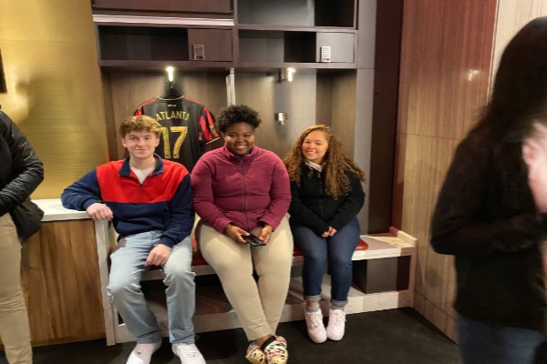 GIFTED TEACHER LAURA COSTELLO HOSTS A  FIELD TRIP TO THE MERCEDES-BENZ STADIUM --- Juniors Grayson Catlett, Destiny Smith sit in the players locker room with other gifted students.