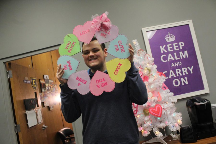 EDITORIAL: LOVE IS IN THE AIR AT CENTRAL HIGH -- Senior James Ortiz, viewed as the most lovable person at Central High, poses with Valentine’s Day decorations. 
