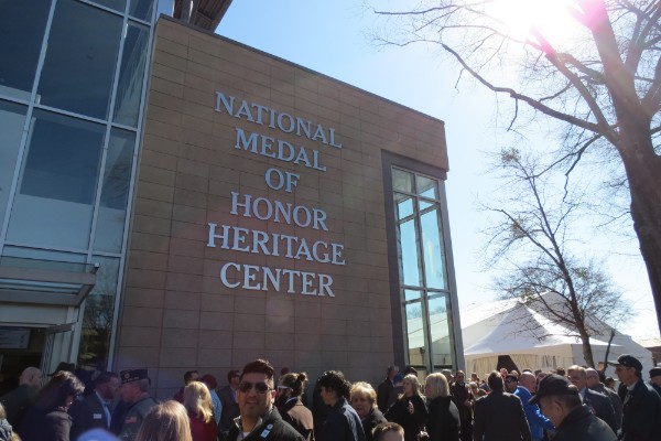 NATIONAL MEDAL OF HONOR HERITAGE CENTER OPENED TO THE PUBLIC -- Community members and recipient families gather at the entrance of the newly-opened museum.
