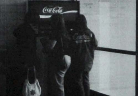  LOOKING BACK: CENTRALS 1978 SCHOOL YEAR SEES INTRODUCTION OF HIGH-ESTEEMED COCA-COLA MACHINES -- Students crowd around one of the new Coke machines during one of their breaks. 
