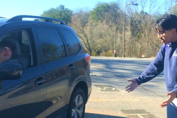 CENTRAL HIGHS PARKING LOT: A CHALLENGE OR LEARNING EXPERIENCE? -- Students, administrators, and parents alike know how hectic and stressful it can be to enter and exit the schools parking lot.