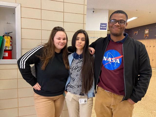 THE YEARS START COMING AND THEY DONT STOP COMING -- Three journalism students (Left to right: Abby Young, Danae Wnuk, Jaheim Williams) stand in the hallway.