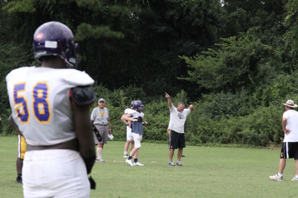 FRIDAY NIGHT LIGHTS ARE BACK -- Coach Curt Jones coaching his team before the first game of the season. 