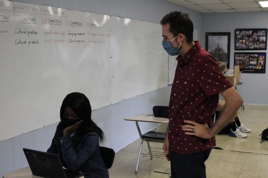 SPANISH TEACHER MARIO ALBA JOINS THE CENTRAL STAFF -- Mario Alba assisting one of his students in class.