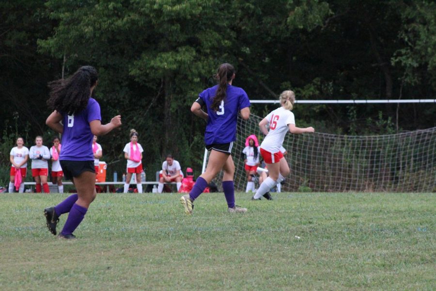 THE GIRLS' SOCCER TEAM CELEBRATES THEIR FIRST WIN OF THE SEASON -- Central players run towards the ball during the game against East Ridge.