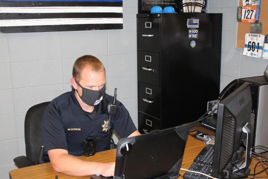 A REINTRODUCTION TO MARCUS DOTSON -- SRO Marcus Dotson working in his office in the main office.