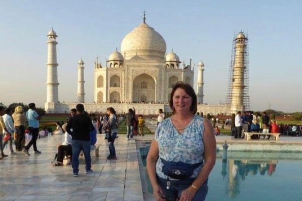 ALUMNI SPOTLIGHT: KATHY RATZ (74) REFLECTS BACK ON HER EDUCATIONAL INSPIRATION FROM CENTRAL-- Kathy Ratz pictured posing in front of the Taj Mahal.
