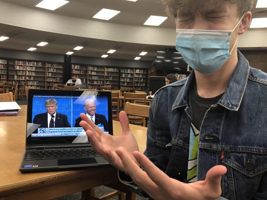 THE+GRAY+AREA%3A+A+CRAZY+ELECTION+FOR+AN+EVEN+CRAZIER+YEAR+--+Senior+Columnist+Grayson+Catlett+turning+away+from+watching+the+presidential+debate+of+September+29%2C+2020.