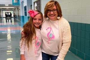 ALUMNA SUZY HALL RETURNS TO TEACH IN HAMILTON COUNTY -- Alumna Suzy Hall embraces a Hunter Middle student.